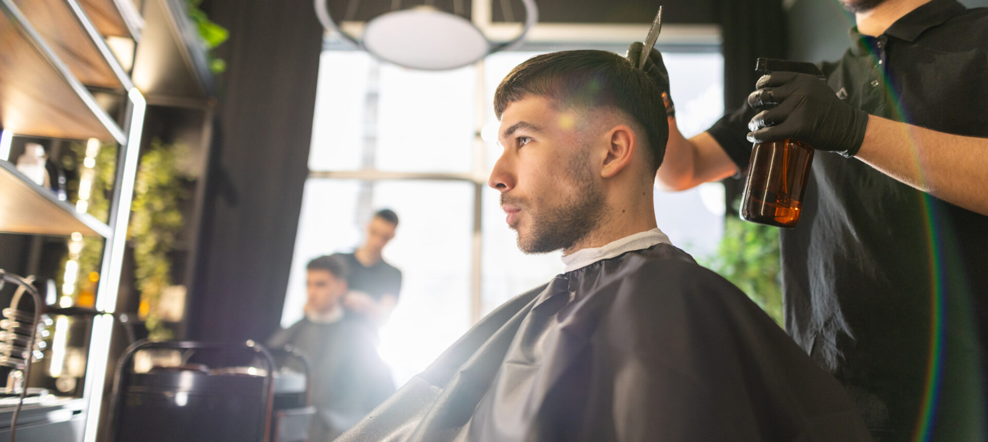 Man getting a haircut in barbershop