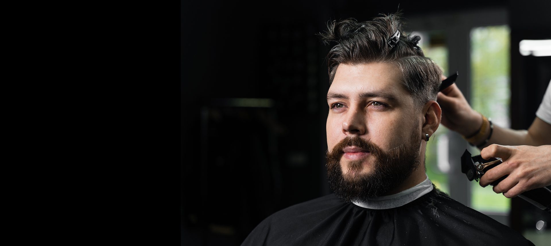 Man getting a haircut at barbershop