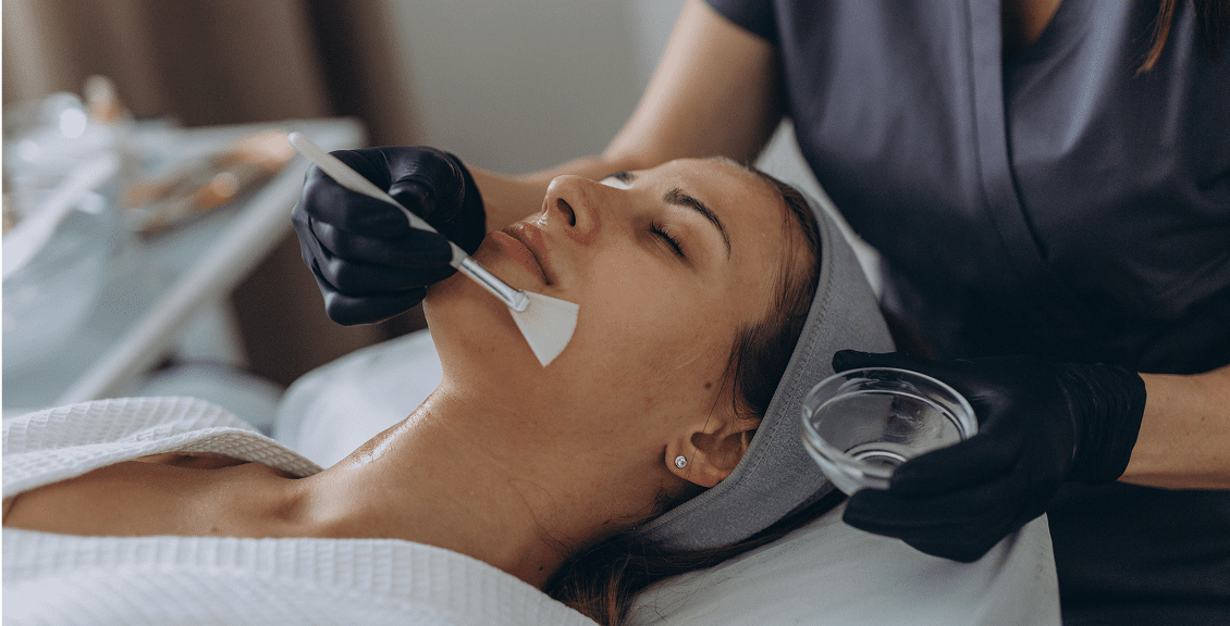 Woman receiving a facial mask