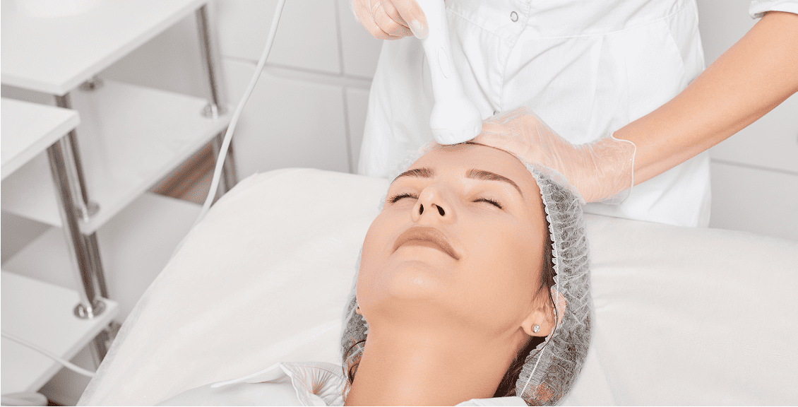 Woman receiving spa facial therapy