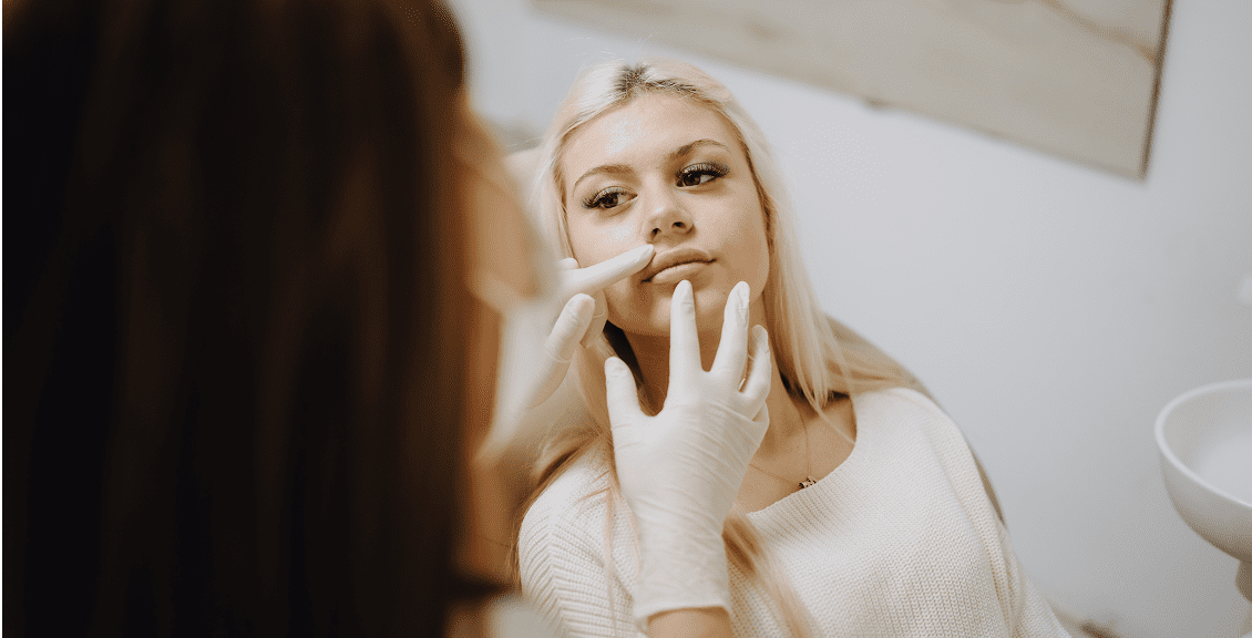 Woman receiving cosmetic consultation