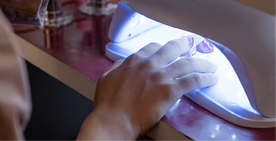 Gel nails curing under light