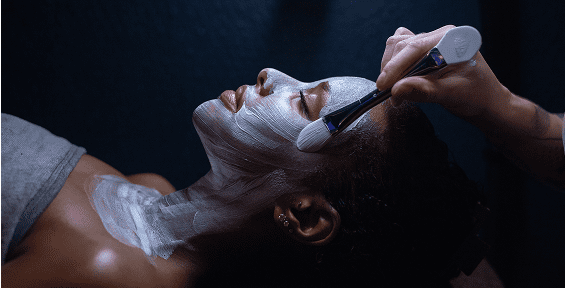 Facial mask being applied with brush