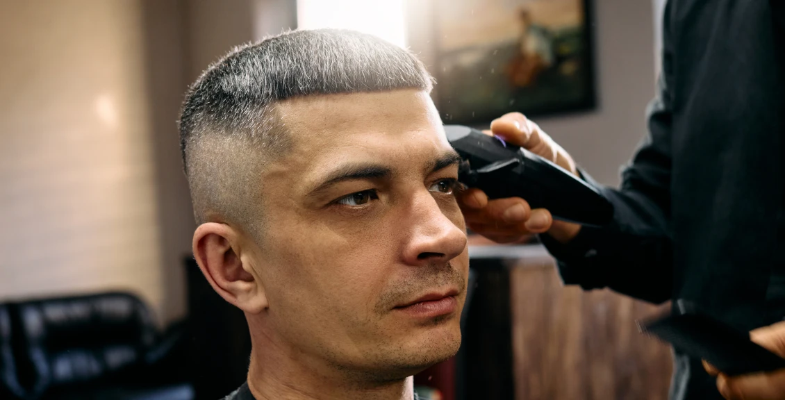 Man getting a haircut at barbershop